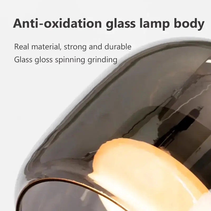 Modern glossy black Nordic glass LED pendant lamp for dining room with warm glow on Tampa Home & Garden Store