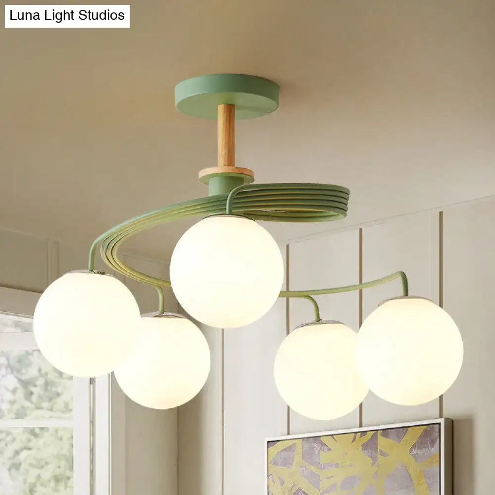 Green Grey Orb Chandelier with five frosted glass globes on green curved arms Decorbites on Tampa Home & Garden Store