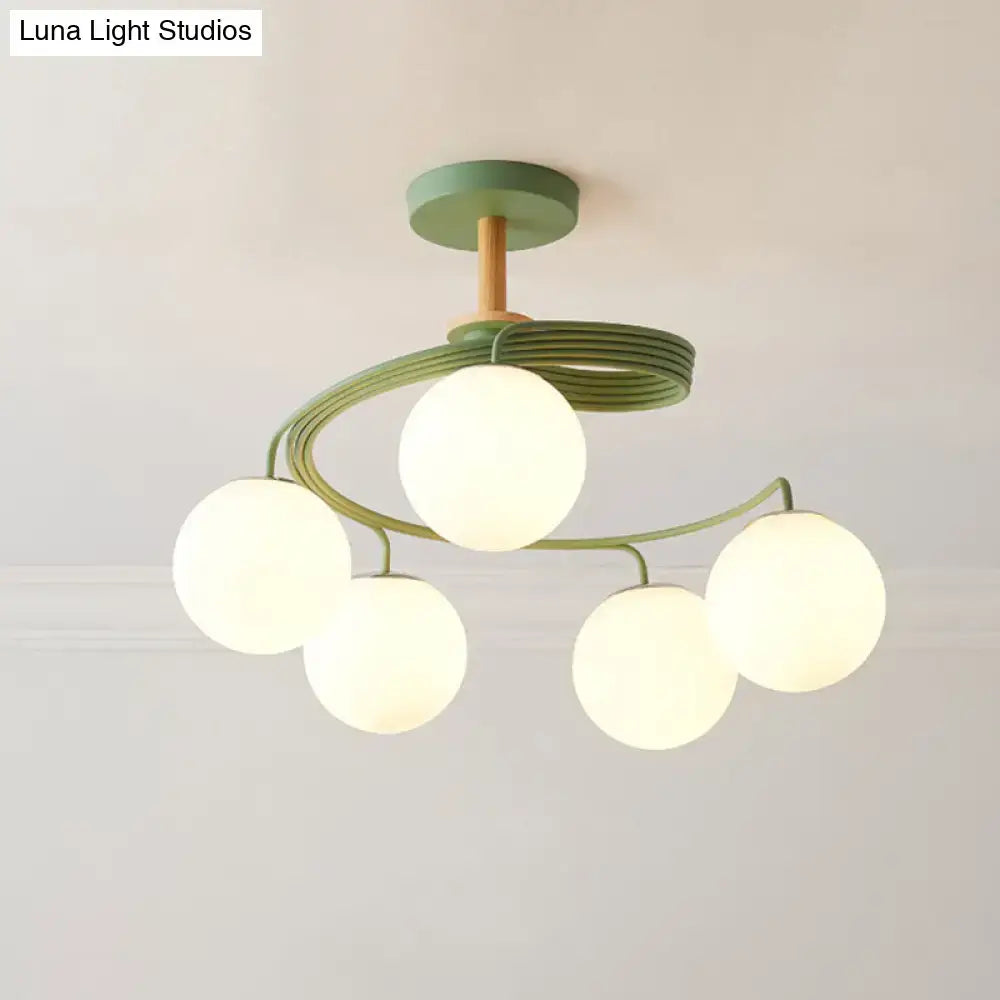 Green Grey Orb Chandelier by Decorbites with five frosted glass globes on Tampa Home & Garden Store