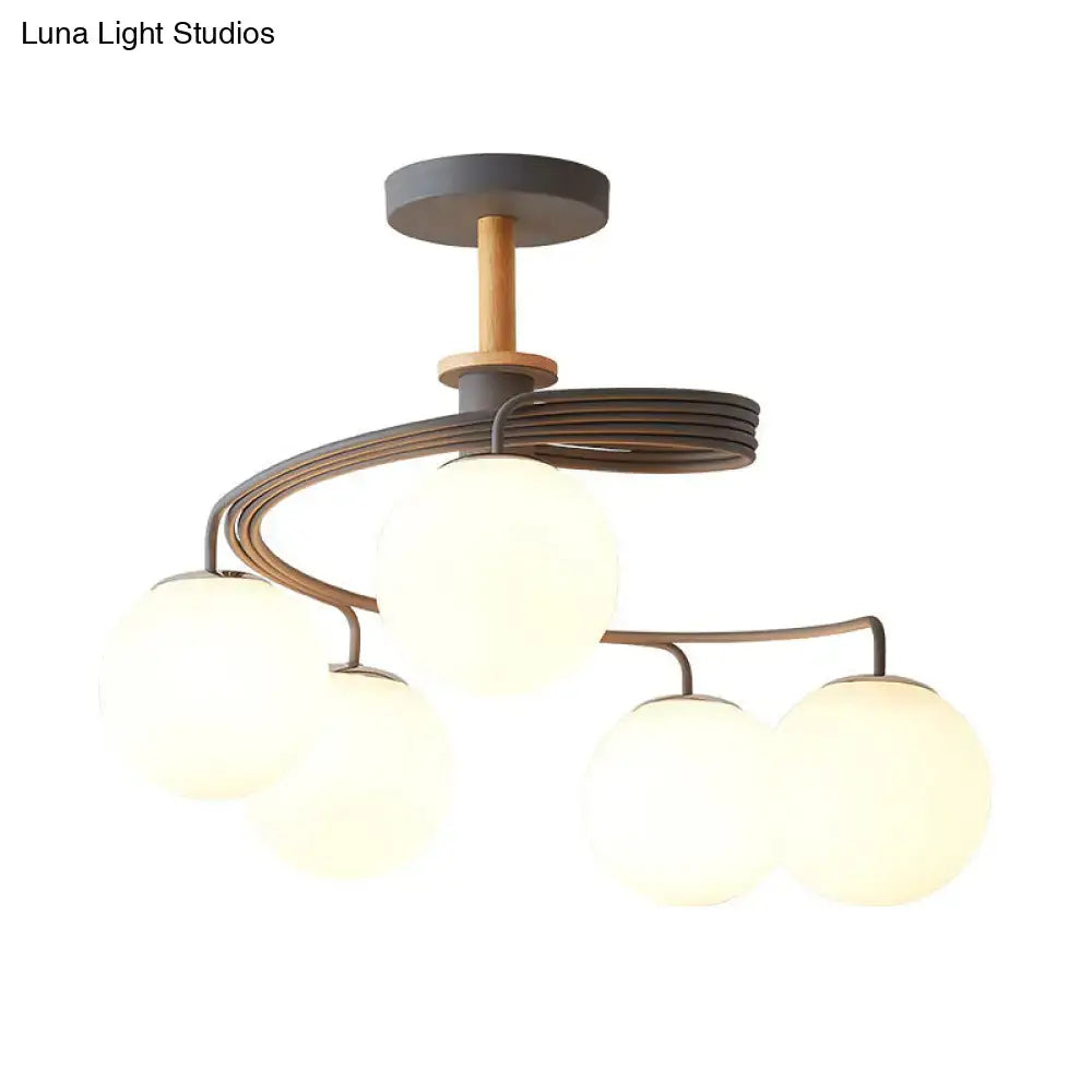 Green Grey Orb Chandelier by Decorbites with frosted glass globes and dark metal arms on Tampa Home & Garden Store