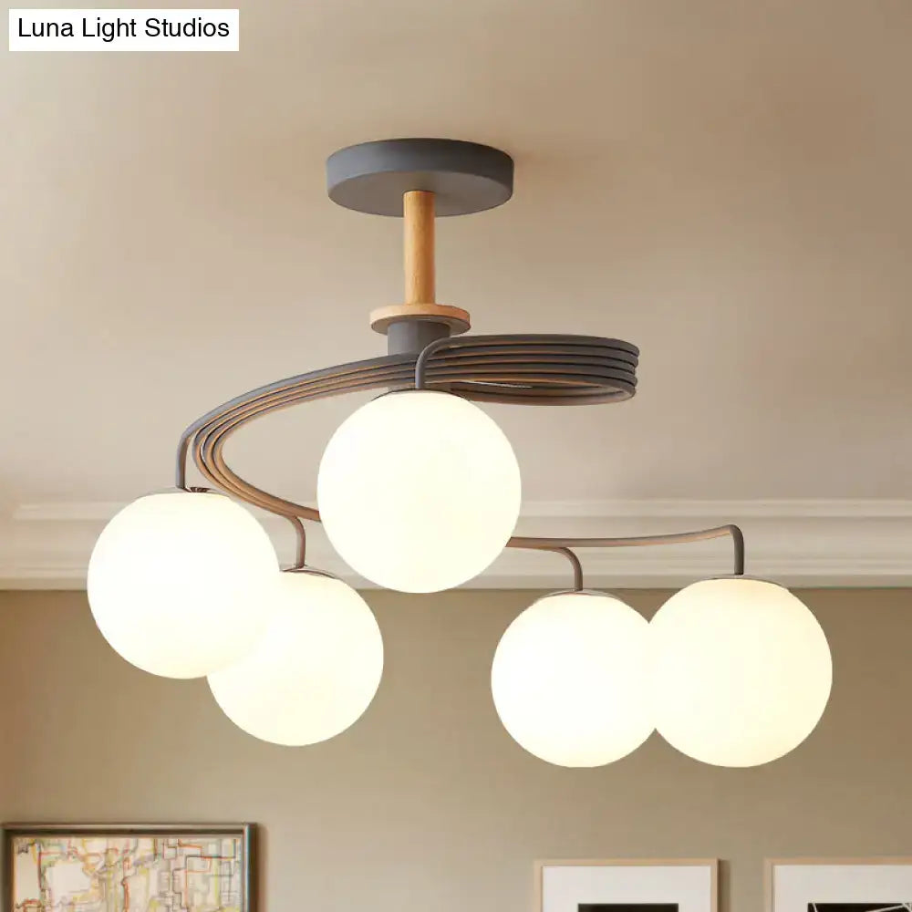Green Grey Orb Chandelier with five frosted glass globes and dark metal arms on wood canopy on Tampa Home & Garden Store
