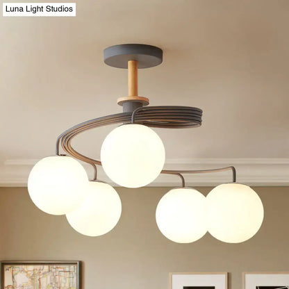 Green Grey Orb Chandelier with five frosted glass globes and dark metal arms on wood canopy on Tampa Home & Garden Store
