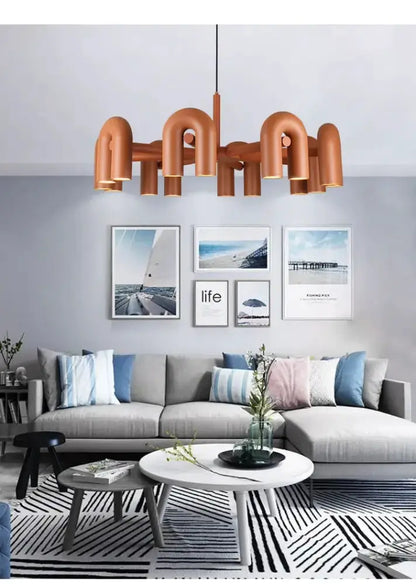 Chandelier Decorbites copper-toned 4-light LED ceiling pendant over living room sofa on Tampa Home & Garden Store