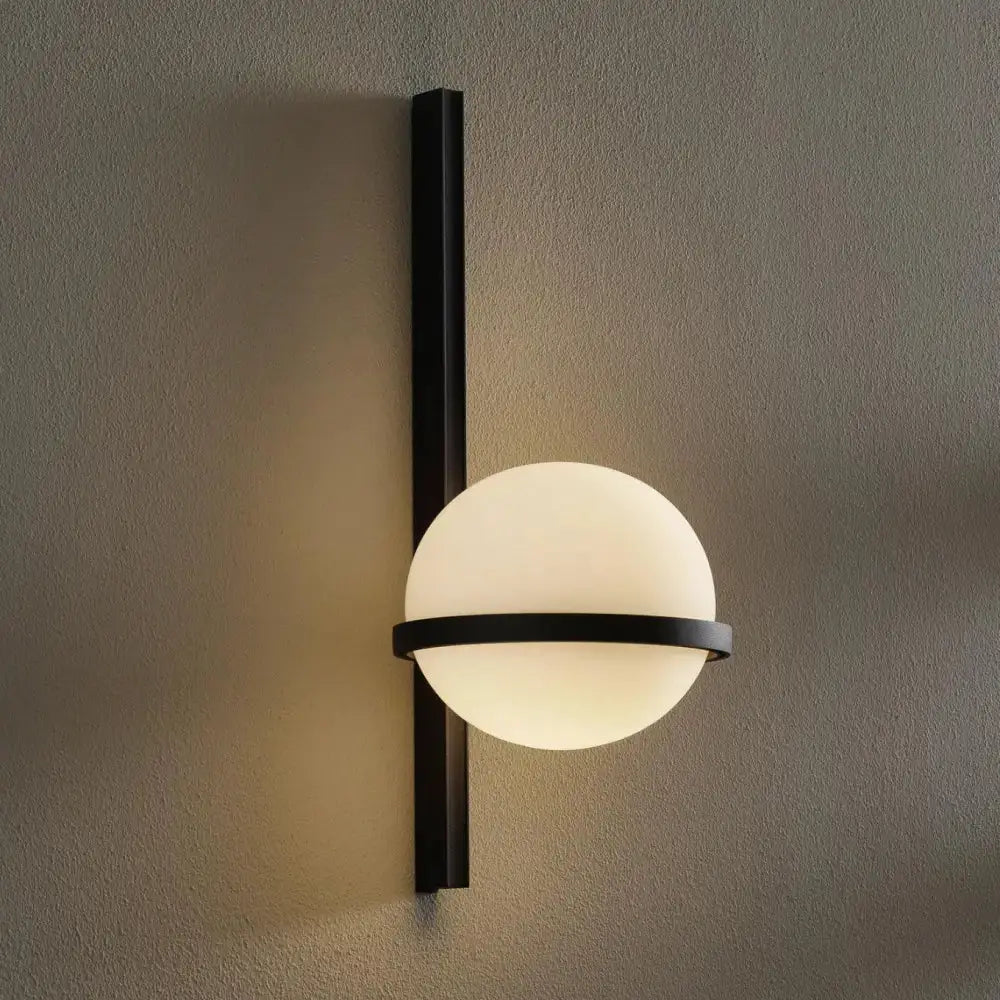 Modern black Nordic wall sconce with frosted glass globe for bedroom on Tampa Home & Garden Store