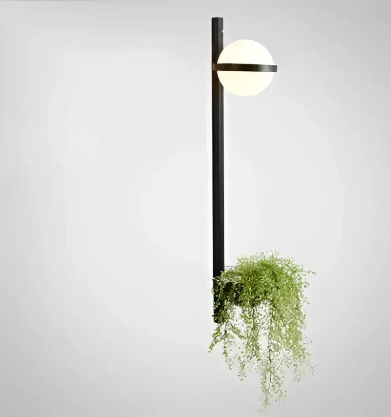 Modern black Nordic planter light sconce with glass globe and trailing greenery Decorbites on Tampa Home & Garden Store