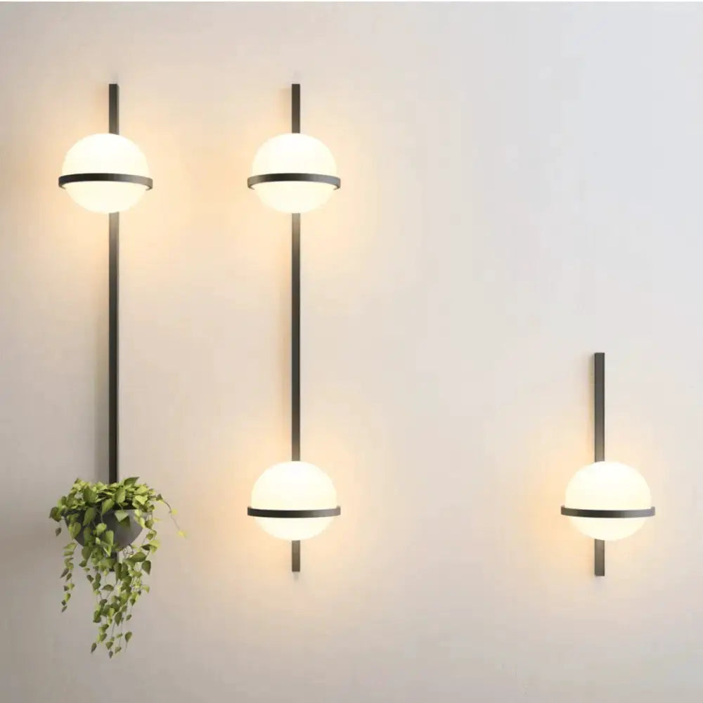 Nordic black planter light sconces set of 3 with glass globes on metal rods by Decorbites on Tampa Home & Garden Store