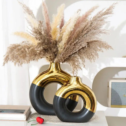 Set of two Black Gold Circle Vases by Decorbites with gold tops and black rings on Tampa Home & Garden Store