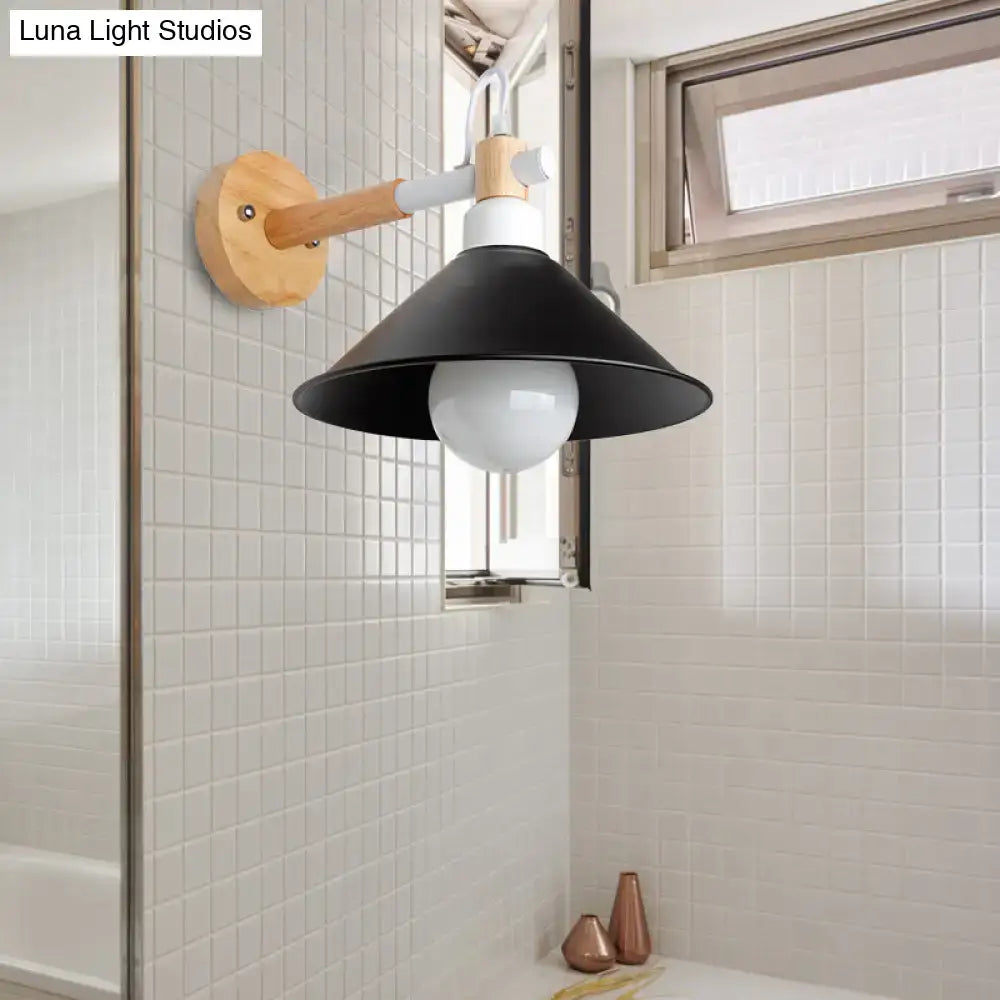 Black wood conic backplate wall sconce with wooden arm and white bulb in tiled bathroom on Tampa Home & Garden Store
