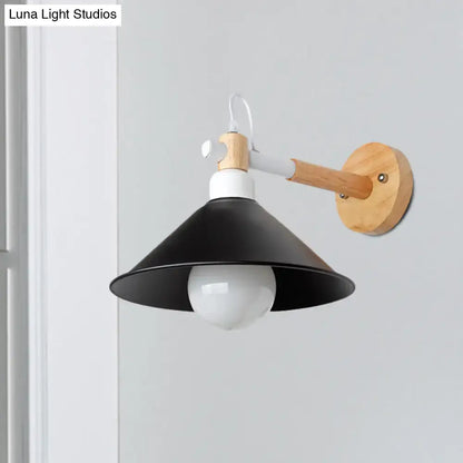 Black metal conic shade wall sconce with natural wood arm and round wooden backplate on Tampa Home & Garden Store