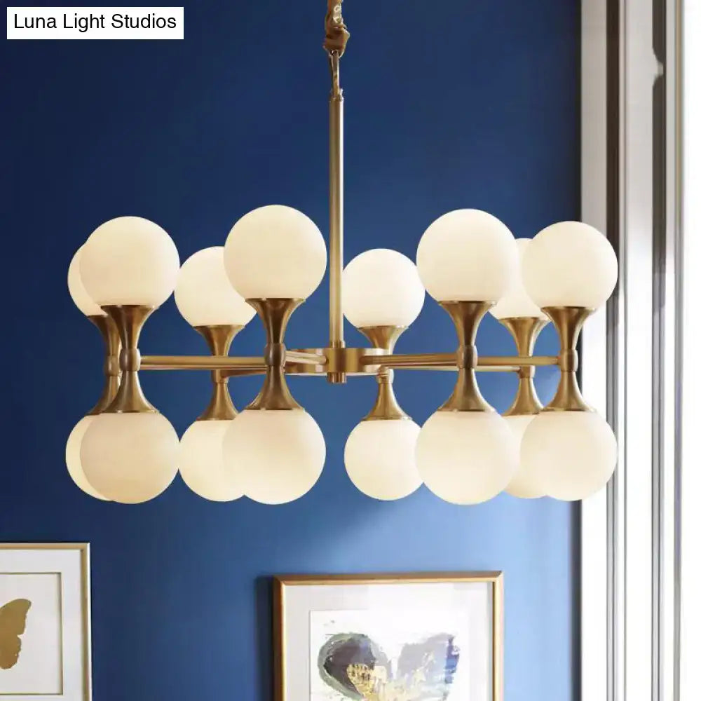 Brass globe chandelier with twelve white frosted glass globes by Decorbites on Tampa Home & Garden Store