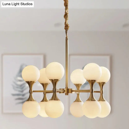 Brass globe chandelier with eight frosted glass globes Decorbites on Tampa Home & Garden Store