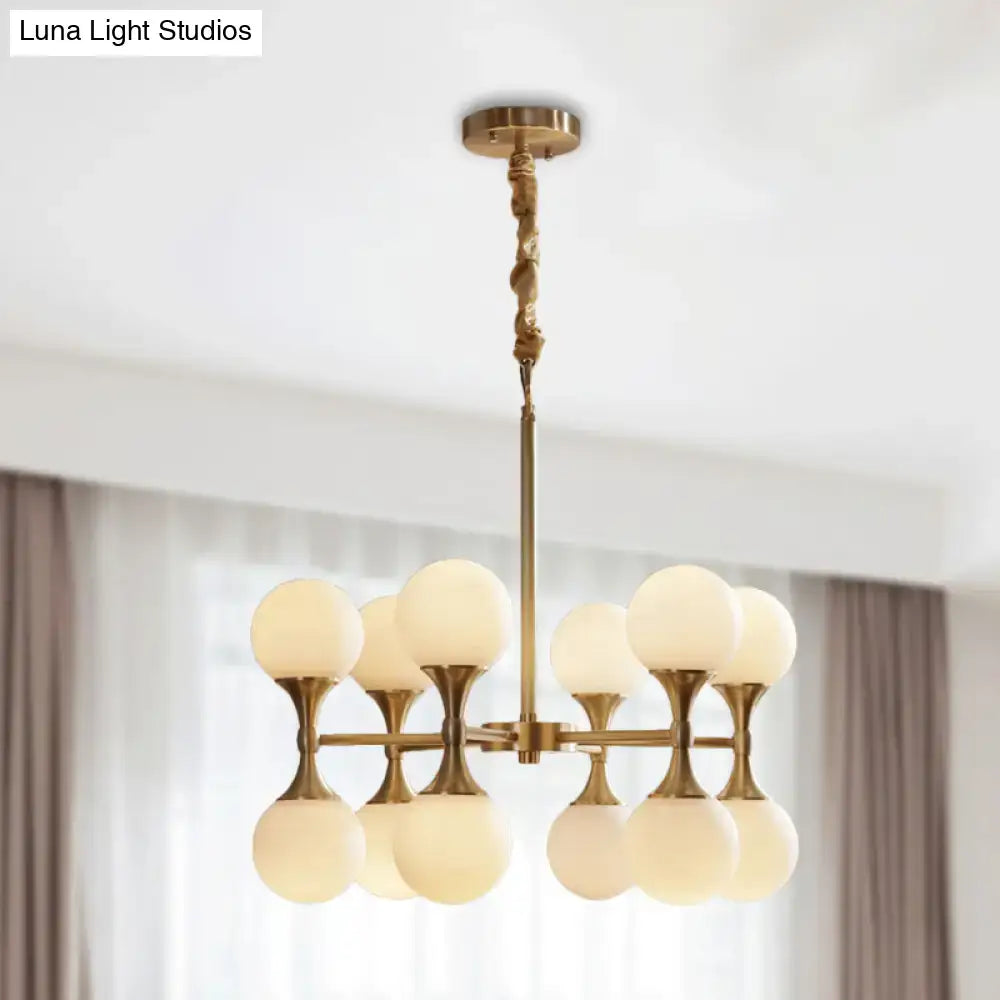 Brass Globe Chandelier with eight frosted glass globes by Decorbites on Tampa Home & Garden Store