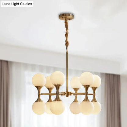 Brass Globe Chandelier with eight frosted glass globes by Decorbites on Tampa Home & Garden Store