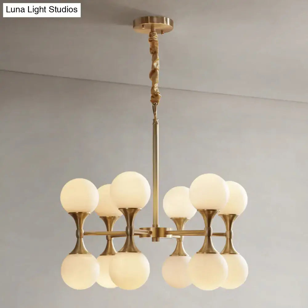 Brass Globe Chandelier with eight frosted glass globes by Decorbites on Tampa Home & Garden Store