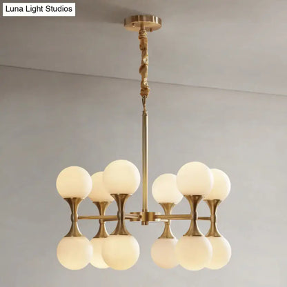Brass Globe Chandelier with eight frosted glass globes by Decorbites on Tampa Home & Garden Store