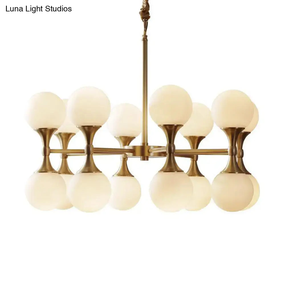 Brass globe chandelier with 12 frosted glass globes in antique brass finish on Tampa Home & Garden Store