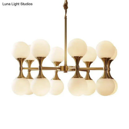 Brass globe chandelier with 12 frosted glass globes in antique brass finish on Tampa Home & Garden Store