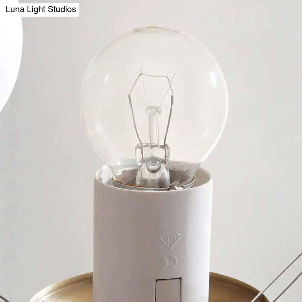 Brass Globe Chandelier by Decorbites, clear glass globe bulb on white cylindrical base on Tampa Home & Garden Store