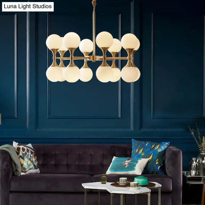 Brass globe chandelier with frosted glass globes by Decorbites on Tampa Home & Garden Store