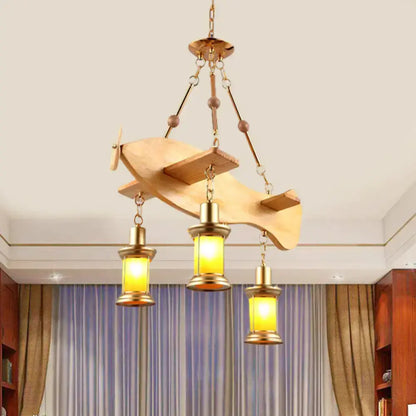 Vintage gold pendant light with orange glass lanterns on a fish guitar canopy Decorbites on Tampa Home & Garden Store