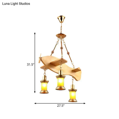Decorbites vintage gold woven pendant light with a wooden canopy and three amber glass lanterns on Tampa Home & Garden Store