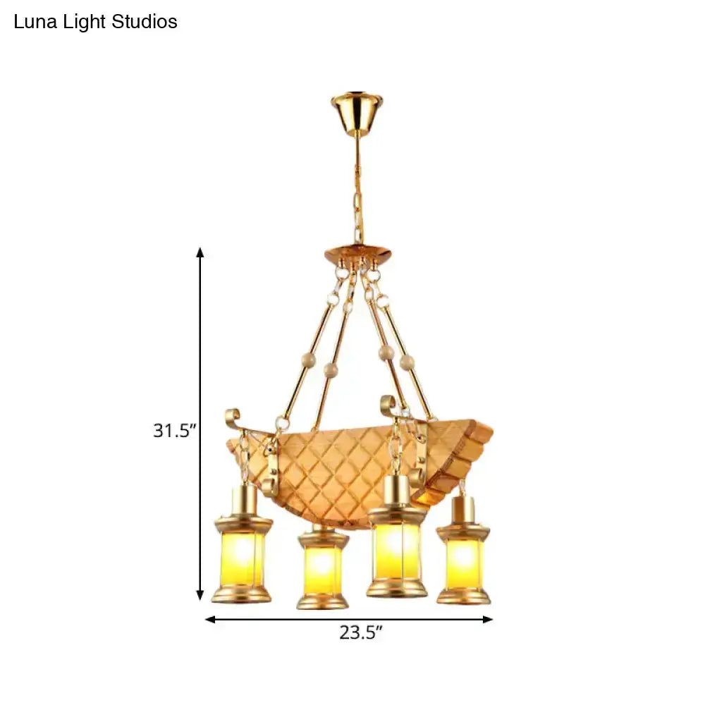 Vintage gold woven pendant light with a basket shade and four orange glass lanterns on Tampa Home & Garden Store
