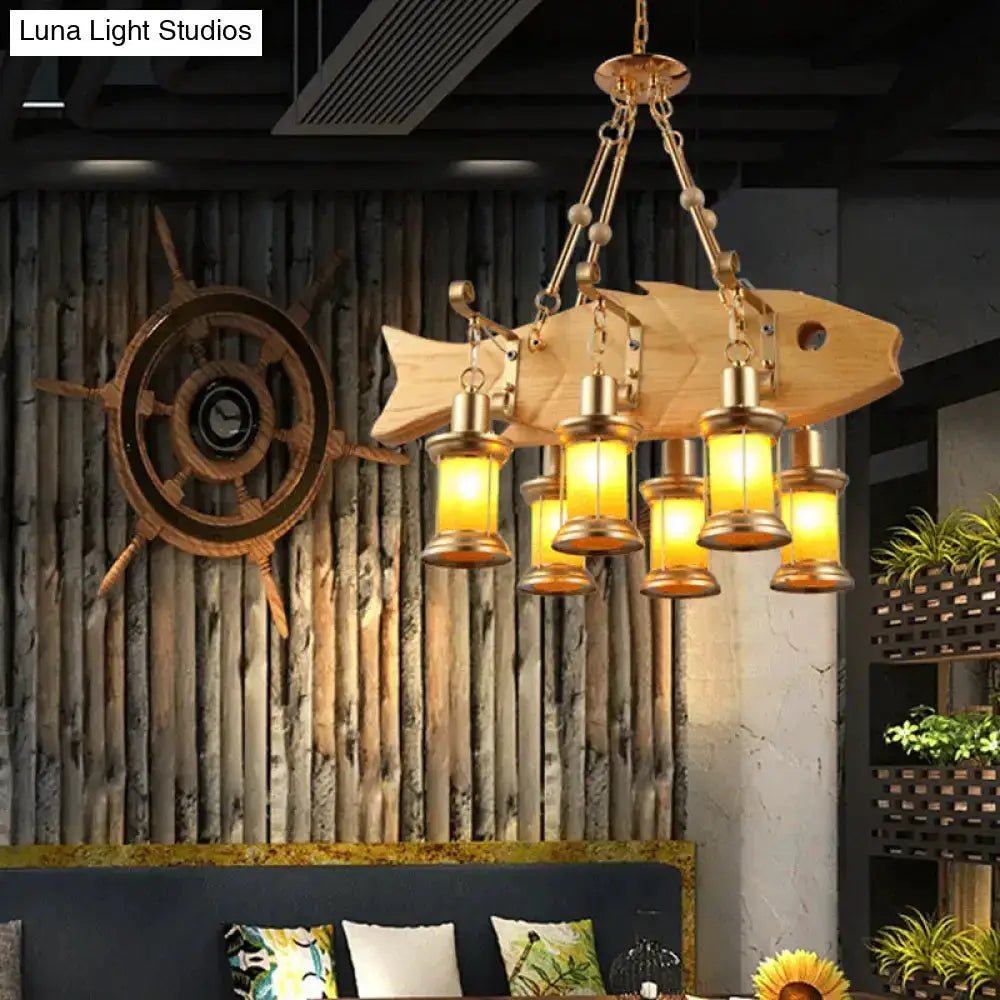 Vintage gold woven pendant light with orange glass lanterns and fish guitar design on Tampa Home & Garden Store