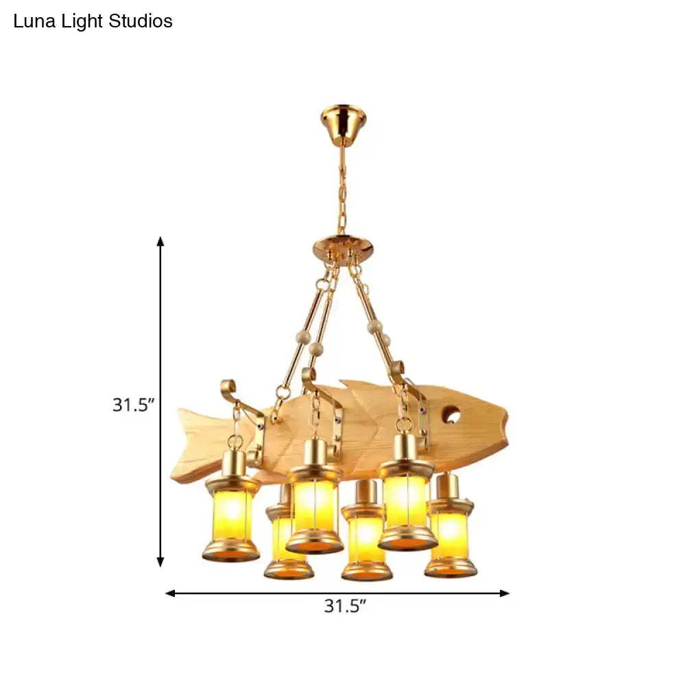 Vintage gold woven pendant light with orange glass lanterns in fish design canopy on Tampa Home & Garden Store
