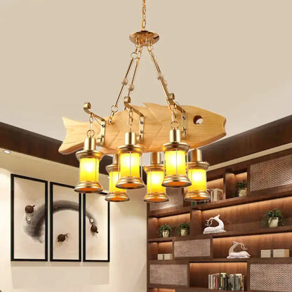 Decorbites vintage woven pendant light with five orange glass lanterns on a wood fish mount on Tampa Home & Garden Store