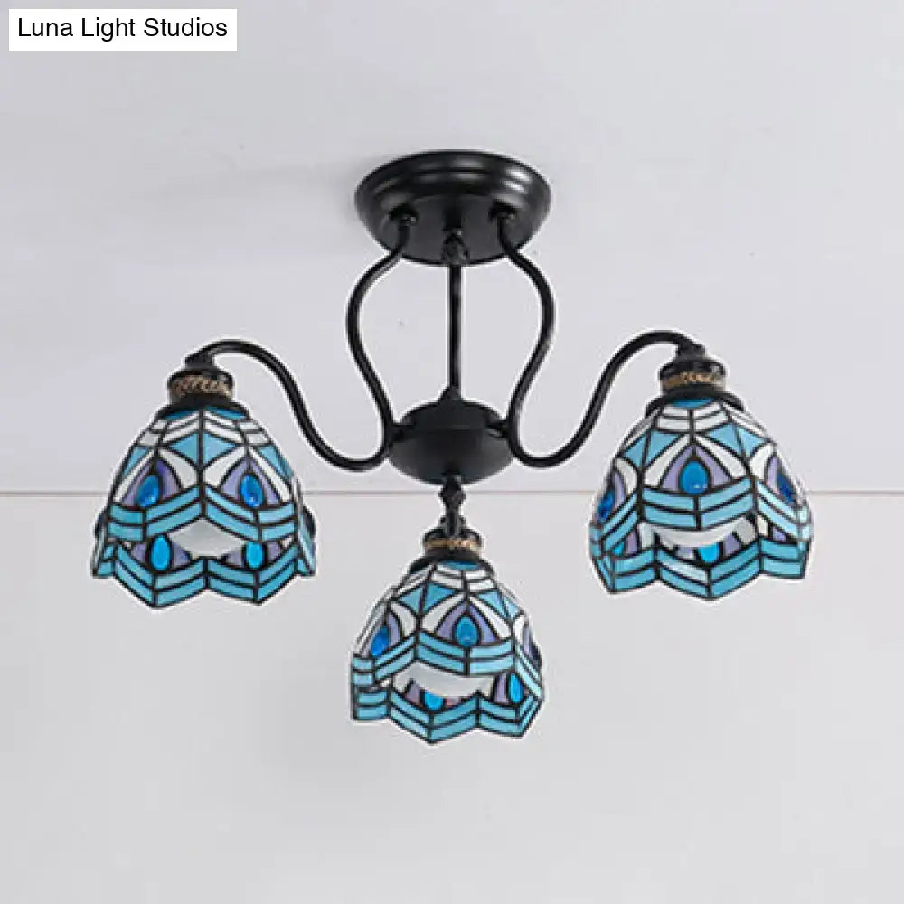 Peacock stained glass light with 3 blue Tiffany-style shades in a Decorbites black metal frame on Tampa Home & Garden Store