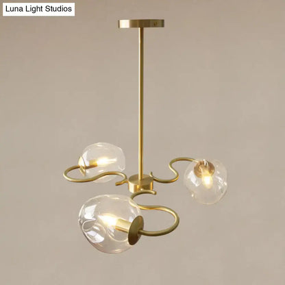 Brass Glass Globe Flush Mount Decorbites with three glass globes on curved brass arms on Tampa Home & Garden Store