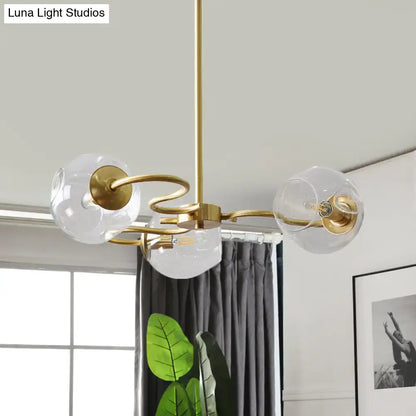 Brass Glass Globe Flush Mount ceiling light with clear glass globes and curved arms on Tampa Home & Garden Store