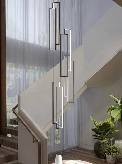 Chandelier modern black and gold rectangle LED design hanging beside a staircase on Tampa Home & Garden Store