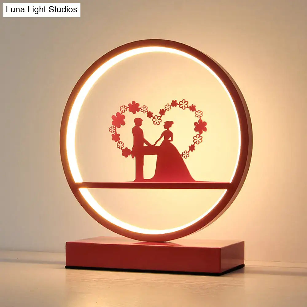 Red loop silhouette lamp with ring light and couple heart silhouette on red base Decorbites on Tampa Home & Garden Store