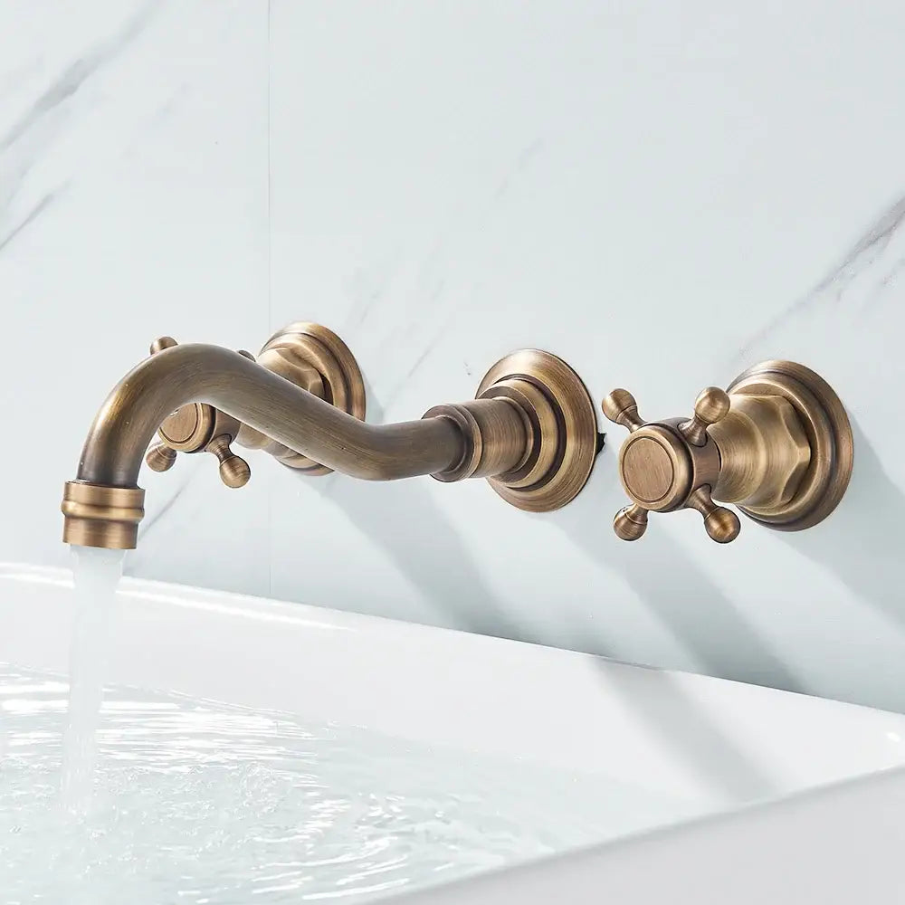 Decorbites antique brass wall faucet with curved spout and cross handles for sinks on Tampa Home & Garden Store