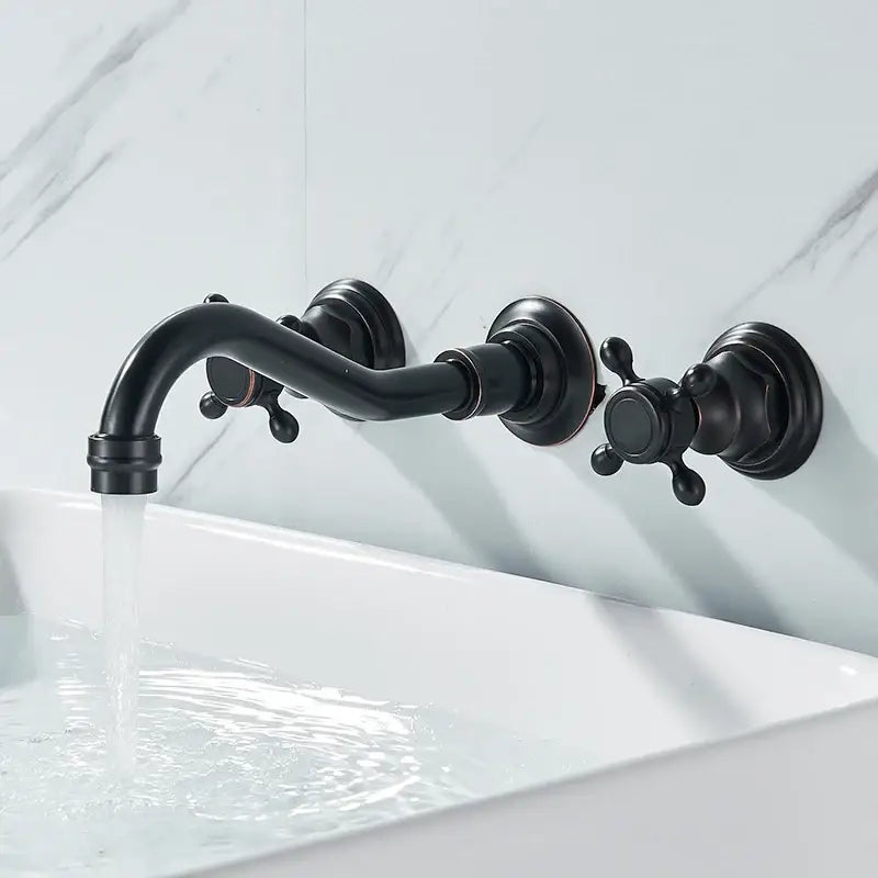 Antique brass wall faucet with curved spout and dual handles for bathroom sinks Decorbites on Tampa Home & Garden Store