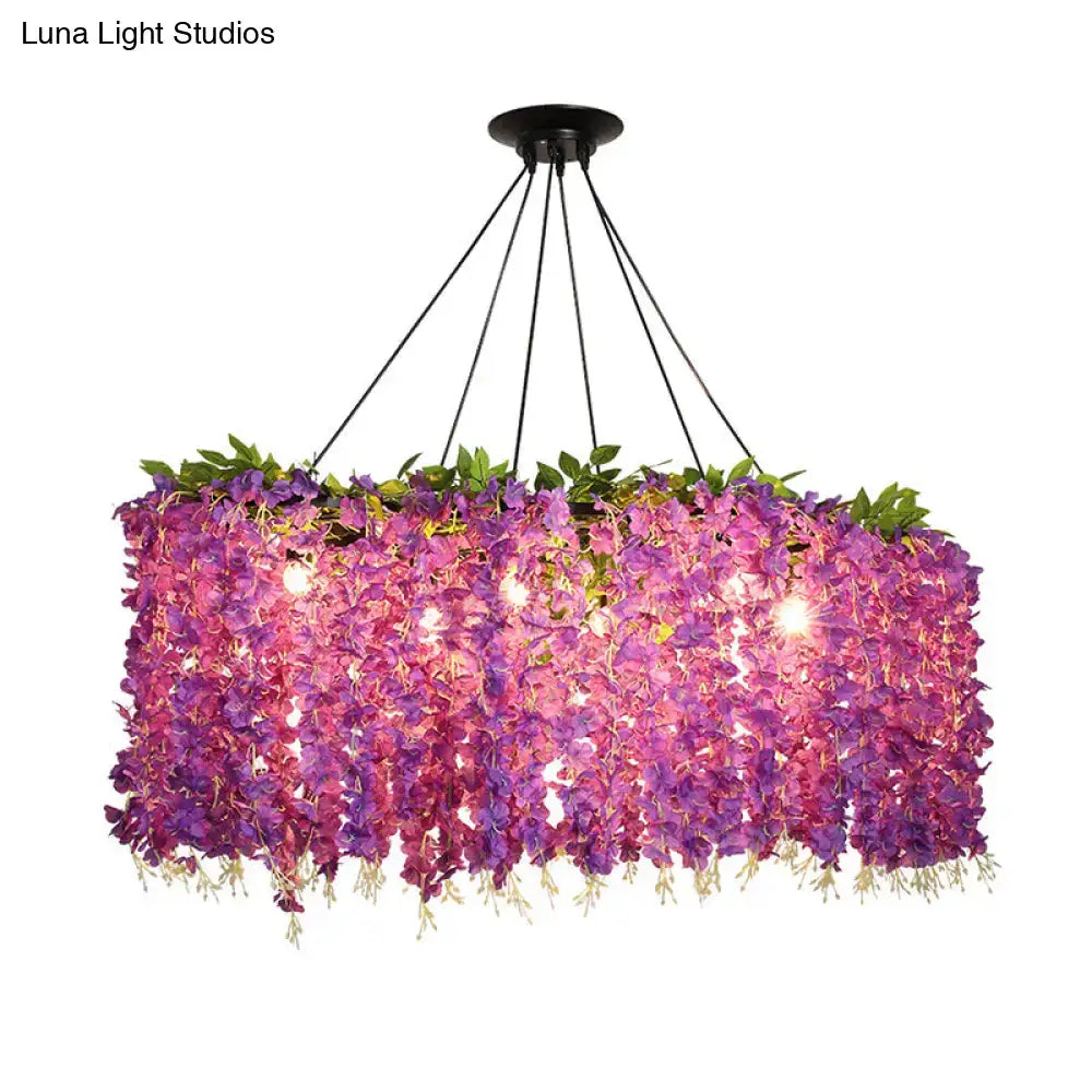 Purple floral ceiling light fixture by Decorbites with cascading petals and green leaves on Tampa Home & Garden Store