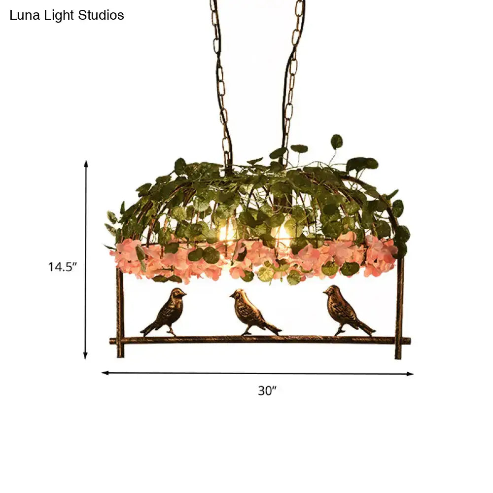 Brass birdcage ceiling light by Decorbites with greenery and pink flowers on Tampa Home & Garden Store