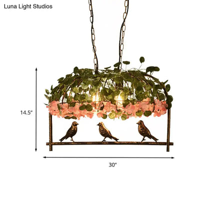 Brass birdcage ceiling light by Decorbites with greenery and pink flowers on Tampa Home & Garden Store