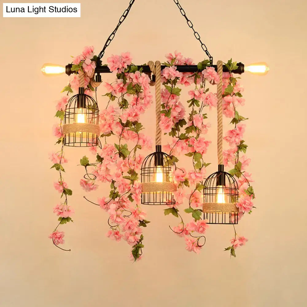 Metal Ivy Island Light pendant; three black wire birdcage lamps with rope and pink ivy garlands on Tampa Home & Garden Store