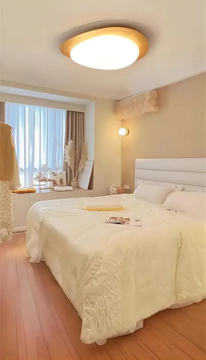 Walnut oval acrylic ceiling light flush mount by Decorbites in warm bedroom ambiance on Tampa Home & Garden Store