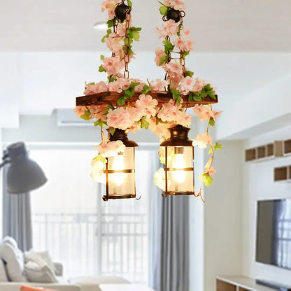 Wooden Ivy Ceiling Light with two lantern-style fixtures and pink floral vines Decorbites on Tampa Home & Garden Store