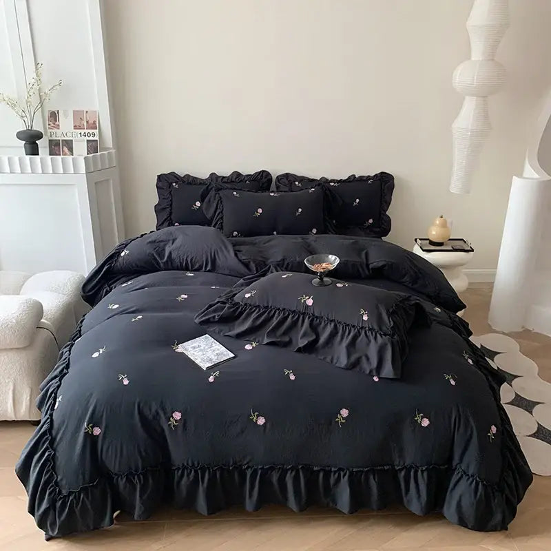 Duvet set by Decorbites in black with pink floral embroidery and ruffled edges on Tampa Home & Garden Store