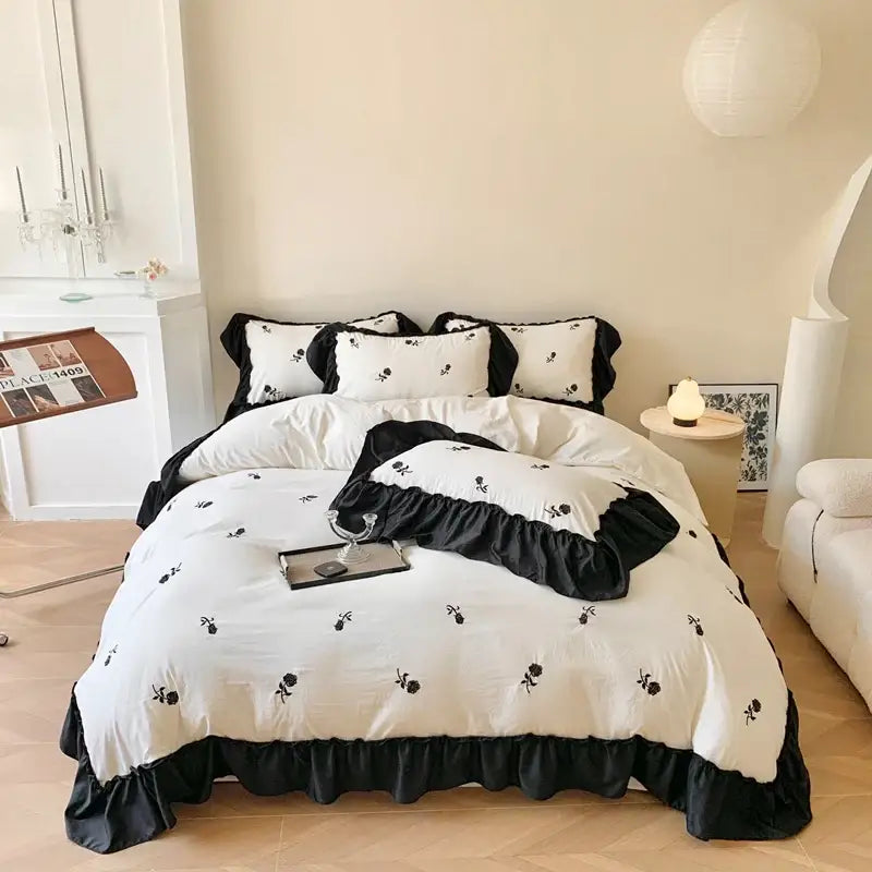 White Ruffled Duvet Set by Decorbites with black trim and floral embroidery on Tampa Home & Garden Store