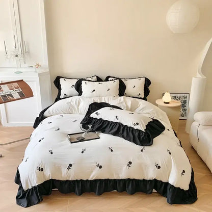 White Ruffled Duvet Set by Decorbites with black trim and floral embroidery on Tampa Home & Garden Store