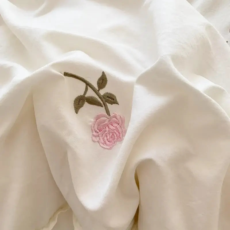 White ruffled duvet set with pink rose embroidery on duvet cover by Decorbites on Tampa Home & Garden Store