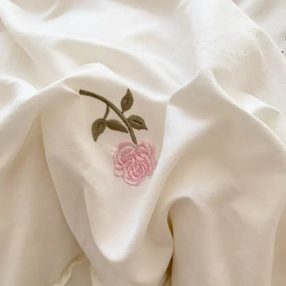 White ruffled duvet set with pink rose embroidery on duvet cover by Decorbites on Tampa Home & Garden Store
