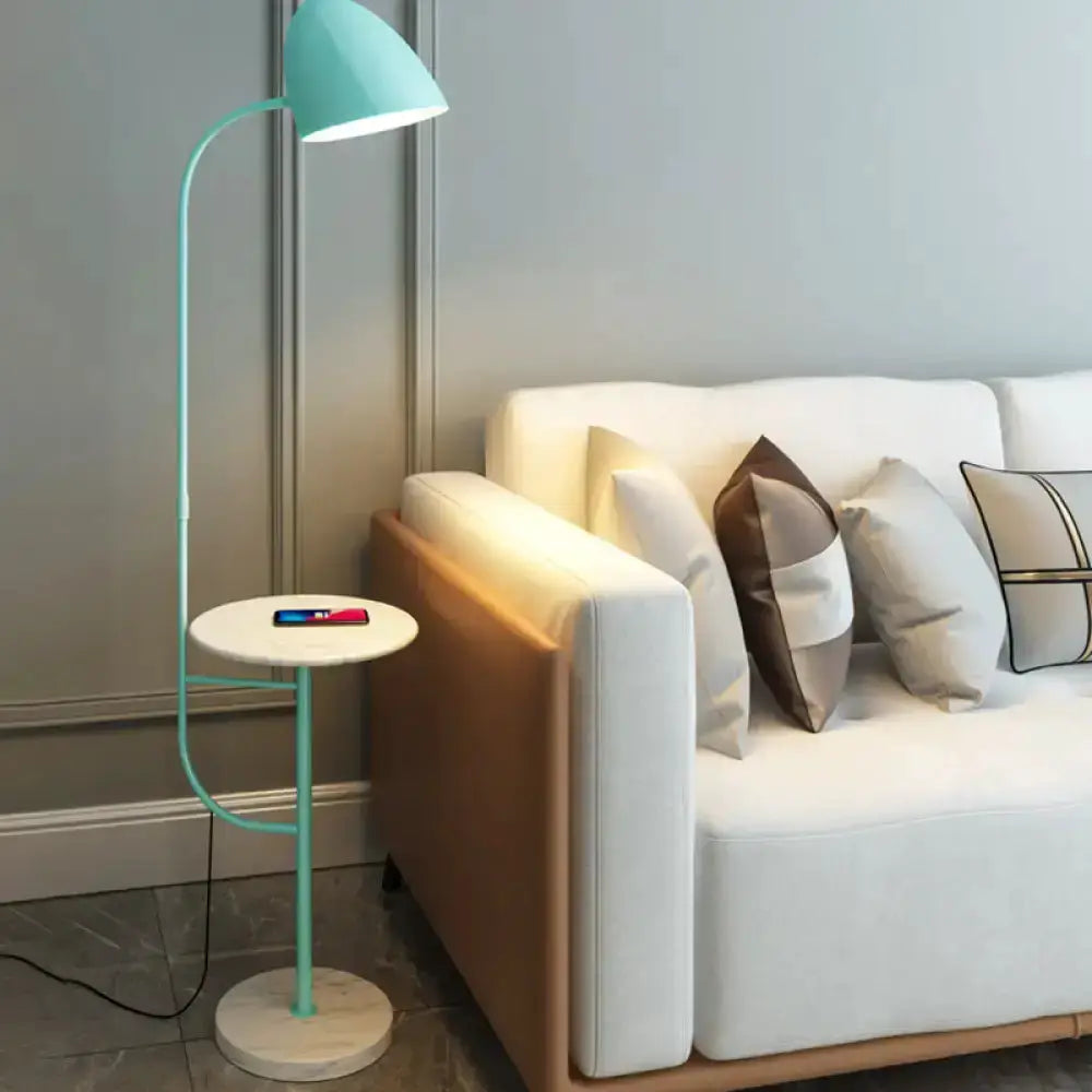 Mint green floor lamp with white marble side table and wireless charging phone beside a sofa on Tampa Home & Garden Store