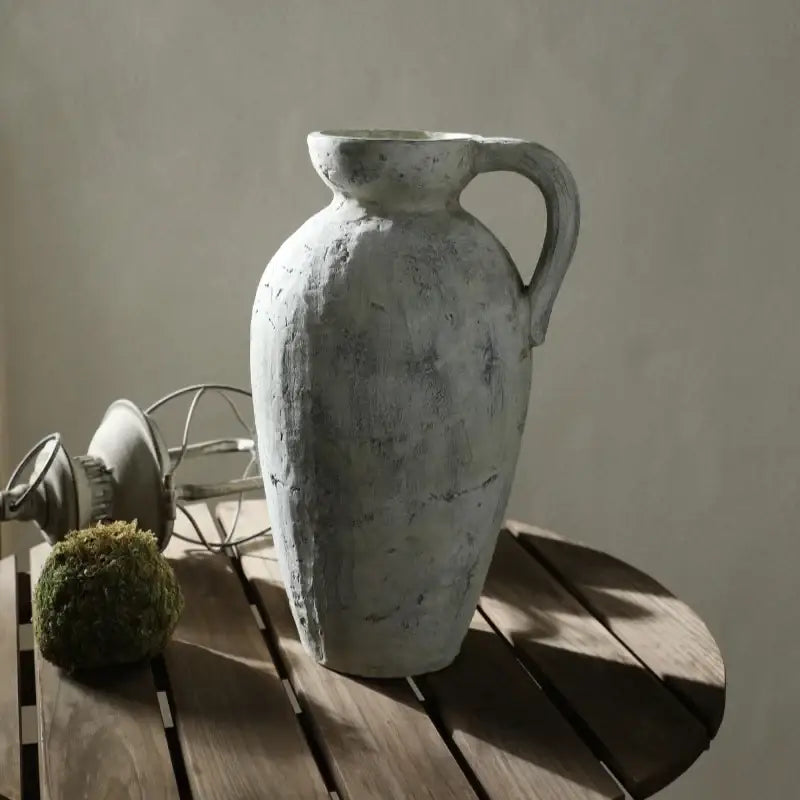 White ceramic pottery vase with a distressed finish and tall amphora-style silhouette on Tampa Home & Garden Store
