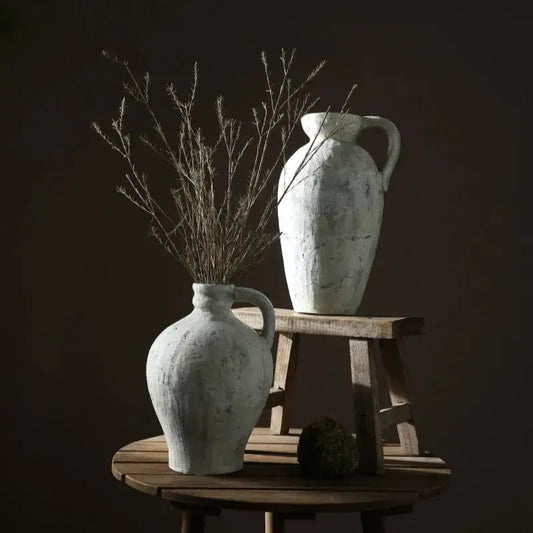 White ceramic pottery vases, 2-piece set with rustic textured glaze on a wooden table on Tampa Home & Garden Store